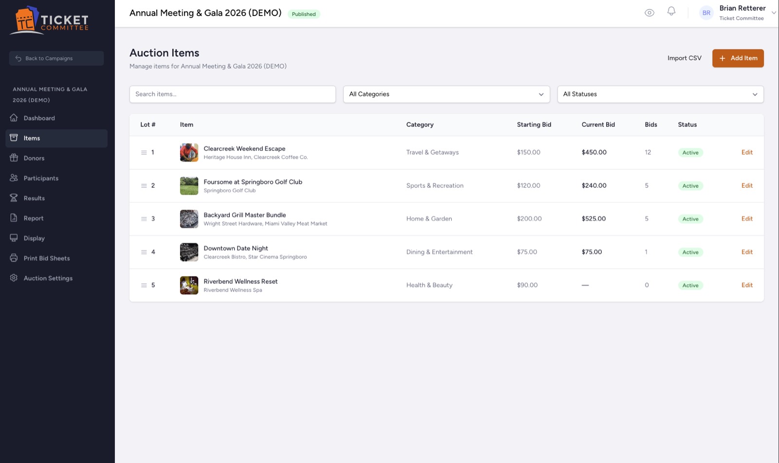 The auction items screen: a table of lots with photos, donors, categories, starting bid, current bid, bid count, and status