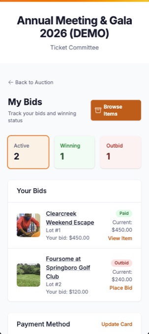 The bidder portal on a phone: two active bids, one winning and one outbid, each with a link back to the lot